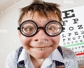 Funny boy wearing spectacles in an office at the doctor Stock Photo - Alamy